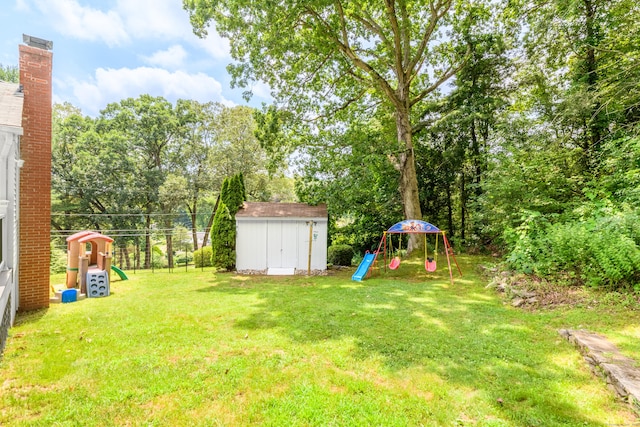 37 Cedar Ln, Beacon Falls, CT 06403 - view of green lawn featuring a playground and a storage unit