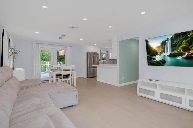 37 Cedar Ln, Beacon Falls, CT 06403 - living area featuring french doors, light wood-style floors, and recessed lighting