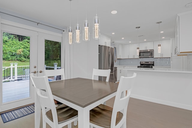 37 Cedar Ln, Beacon Falls, CT 06403 - dining area with light wood finished floors, french doors, and recessed lighting