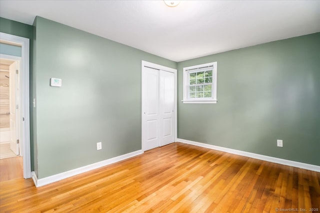 234 Forest Dr, Wethersfield, CT 06109 - unfurnished bedroom featuring light wood finished floors and a closet