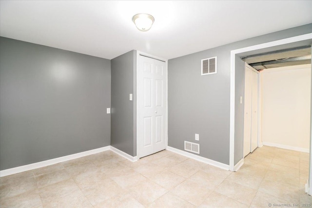 234 Forest Dr, Wethersfield, CT 06109 - unfurnished bedroom with baseboards and a closet