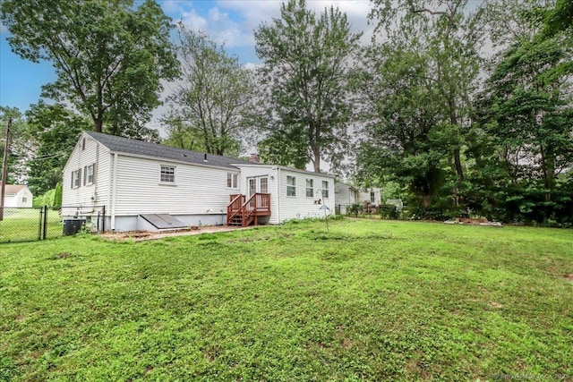 234 Forest Dr, Wethersfield, CT 06109 - rear view of property with a chimney and view of scattered trees