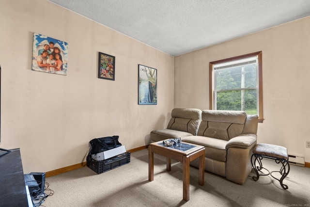 190 Main St, Plainfield, CT 06354 - living room with a baseboard heating unit, carpet flooring, and a textured ceiling