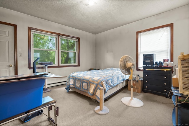 190 Main St, Plainfield, CT 06354 - carpeted bedroom featuring a baseboard radiator and a textured ceiling
