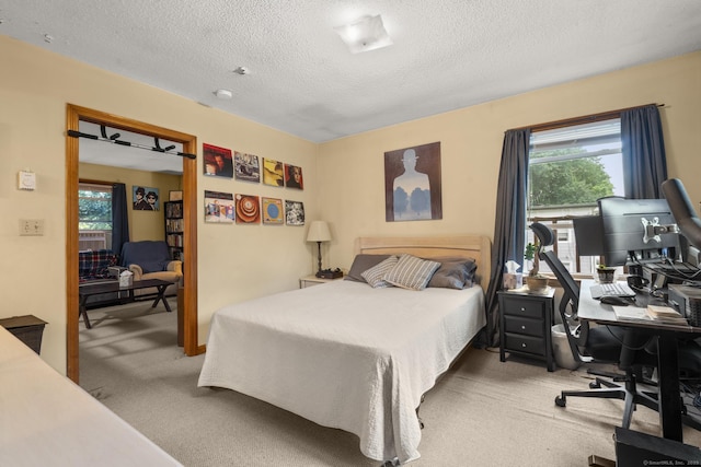 190 Main St, Plainfield, CT 06354 - carpeted bedroom featuring a desk, multiple windows, and a textured ceiling