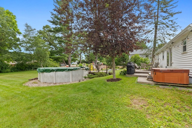 25 Delmar Dr, Bristol, CT 06010 - view of green lawn with a hot tub, a covered pool, and a patio