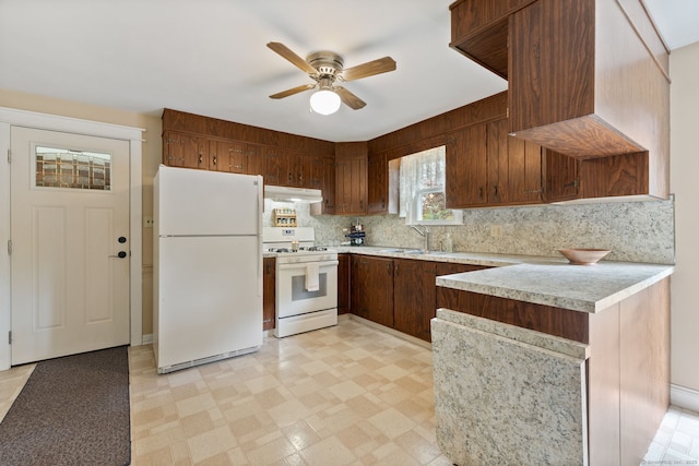 25 Delmar Dr, Bristol, CT 06010 - kitchen with white appliances, under cabinet range hood, light countertops, and backsplash
