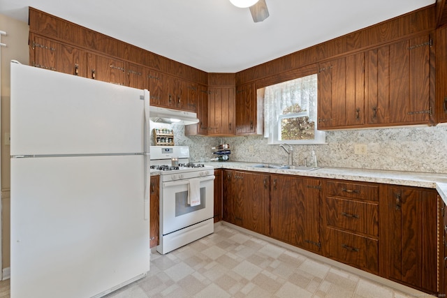 25 Delmar Dr, Bristol, CT 06010 - kitchen featuring white appliances, under cabinet range hood, decorative backsplash, and light countertops