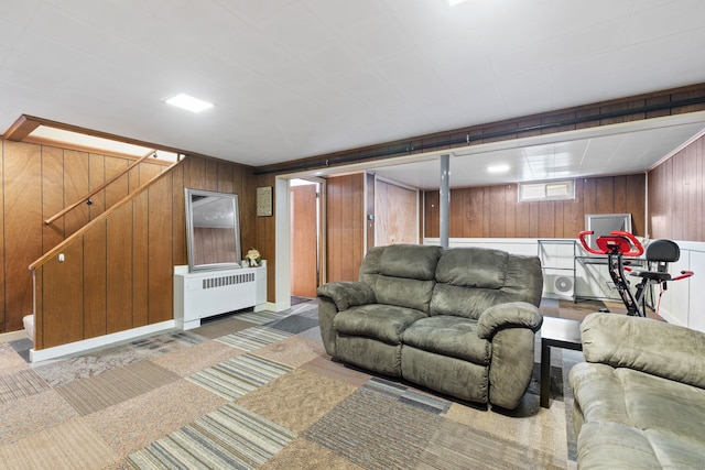 25 Delmar Dr, Bristol, CT 06010 - living room with radiator heating unit, wooden walls, and stairs