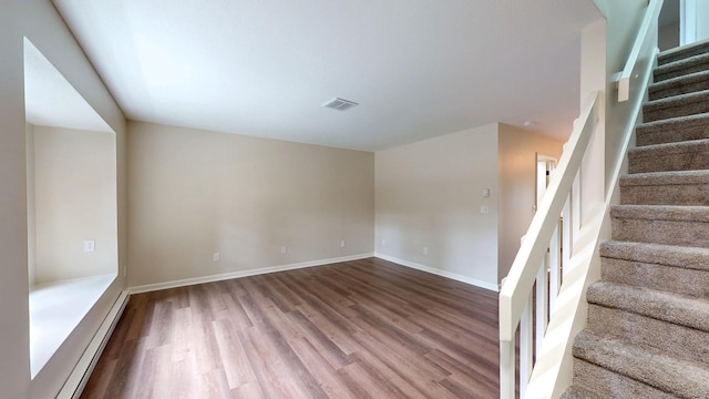10 Cianci Ave Apt 9, Plainville, CT 06062 - staircase featuring wood finished floors and baseboard heating