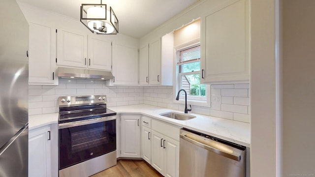 10 Cianci Ave Apt 9, Plainville, CT 06062 - kitchen with appliances with stainless steel finishes, under cabinet range hood, and white cabinetry