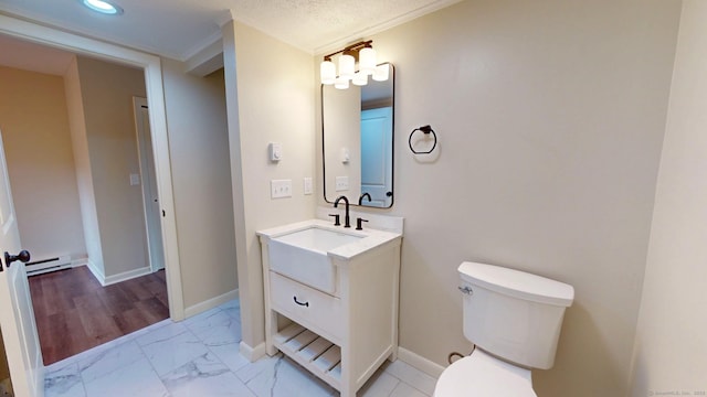 10 Cianci Ave Apt 9, Plainville, CT 06062 - bathroom with a baseboard heating unit, vanity, marble look tile flooring, and recessed lighting