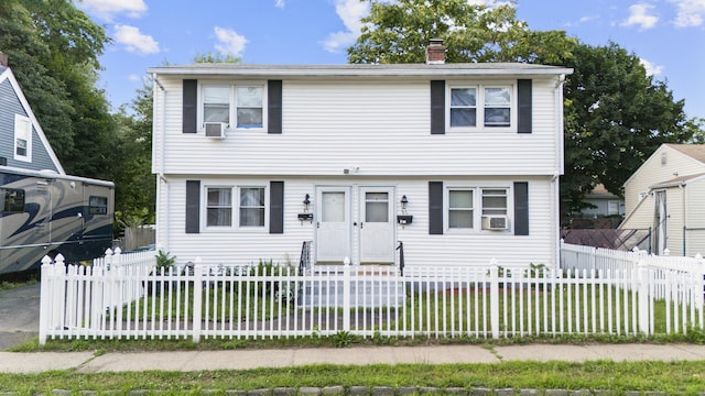 81 W Easton St, Hamden, CT 06514 - colonial home with a chimney, a front yard, and cooling unit