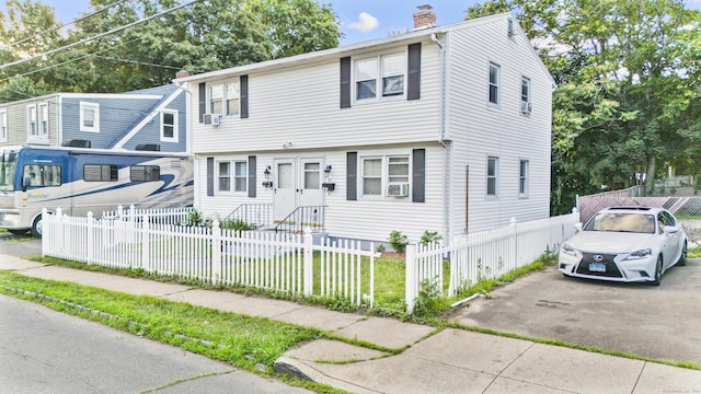81 W Easton St, Hamden, CT 06514 - colonial inspired home featuring a chimney and a fenced front yard