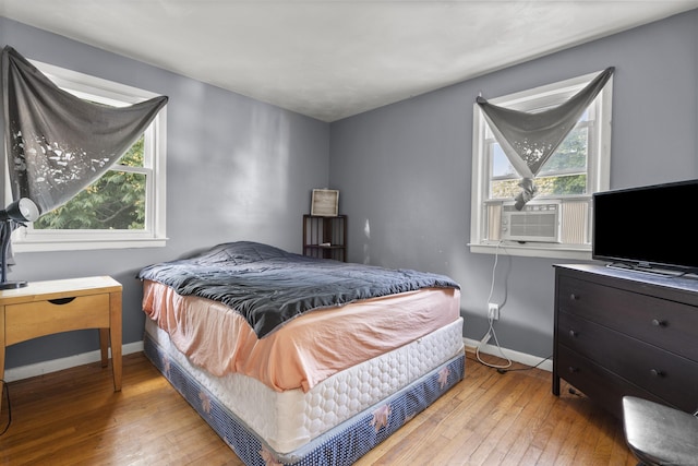 81 W Easton St, Hamden, CT 06514 - bedroom with wood-type flooring, cooling unit, and multiple windows