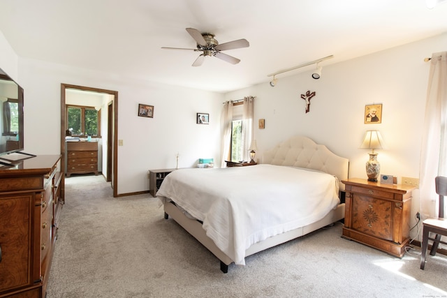 22 Ledgewood Rd, Redding, CT 06896 - bedroom with light carpet, multiple windows, track lighting, and a ceiling fan