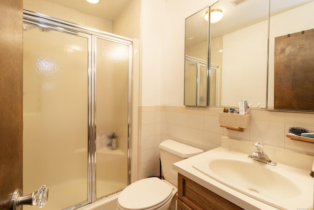 22 Ledgewood Rd, Redding, CT 06896 - bathroom with a shower stall, vanity, tile walls, and wainscoting