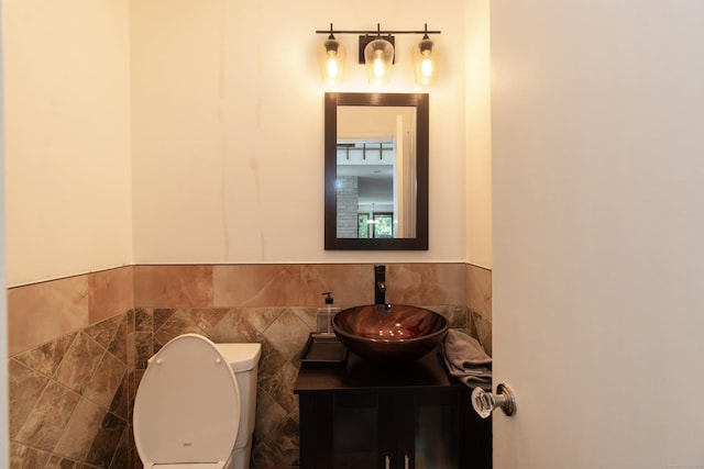 22 Ledgewood Rd, Redding, CT 06896 - bathroom featuring vanity, tile walls, and wainscoting