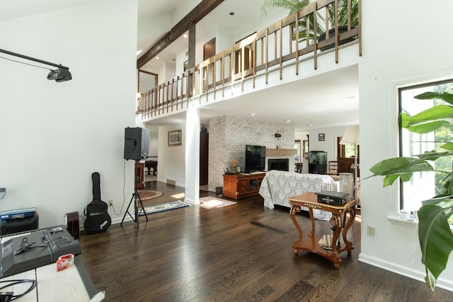22 Ledgewood Rd, Redding, CT 06896 - living area with a high ceiling, wood finished floors, beam ceiling, and a fireplace
