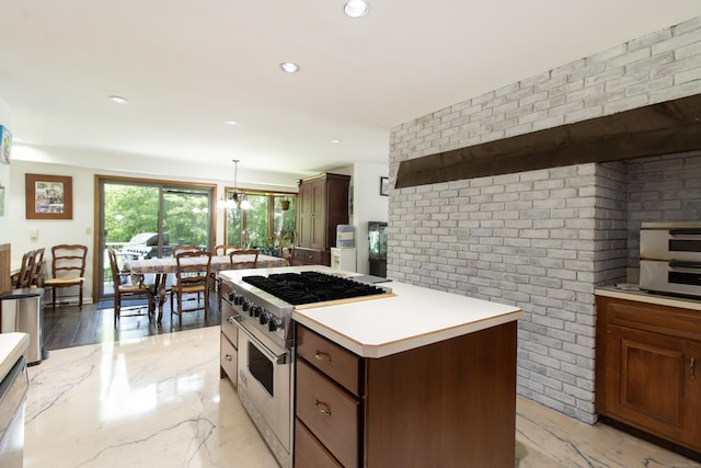 22 Ledgewood Rd, Redding, CT 06896 - kitchen featuring high end range, light countertops, a center island, light marble finish flooring, and pendant lighting
