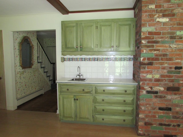 indoor wet bar with baseboard heating, stairway, light wood-style floors, and decorative backsplash