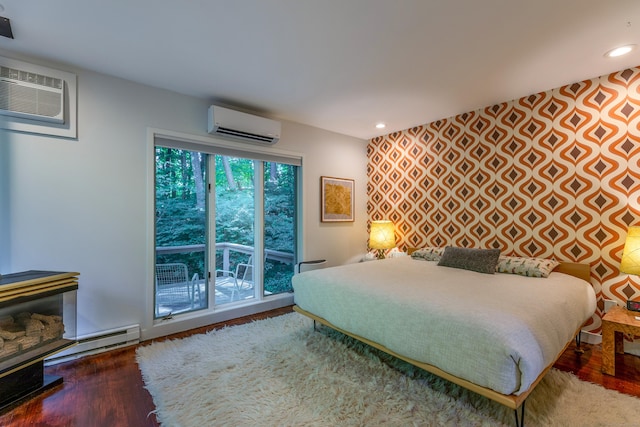 96 Sherman Rd, New Milford, CT 06776 - bedroom with an AC wall unit, a baseboard radiator, an accent wall, wood finished floors, and recessed lighting
