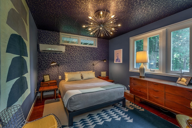 96 Sherman Rd, New Milford, CT 06776 - bedroom featuring an AC wall unit, wood finished floors, a chandelier, and multiple windows