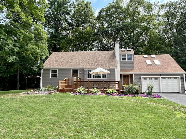 38 Tanglewood Rd, Farmington, CT 06032 - view of front of home with an attached garage, asphalt driveway, a front yard, and a deck