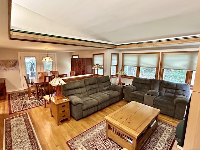 38 Tanglewood Rd, Farmington, CT 06032 - living area with plenty of natural light, light wood finished floors, and lofted ceiling