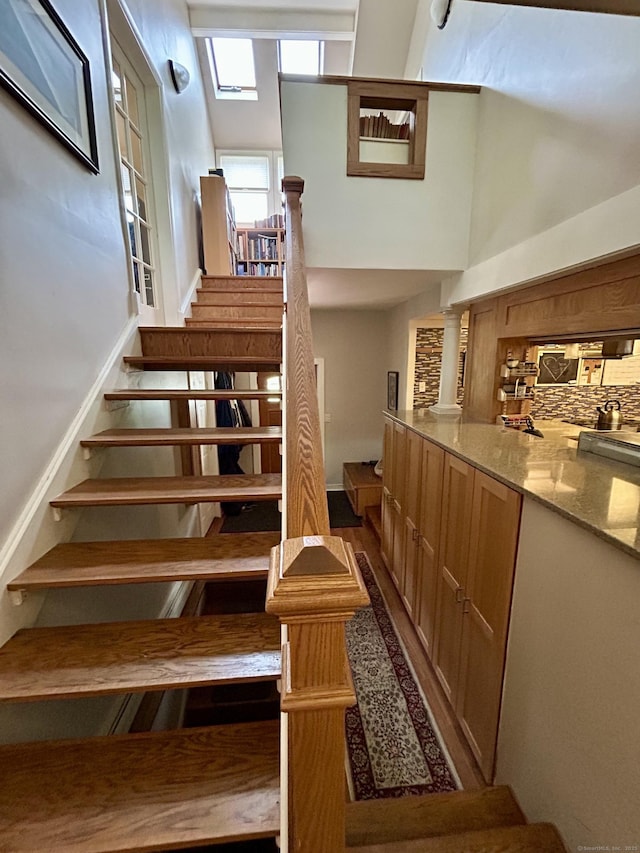 38 Tanglewood Rd, Farmington, CT 06032 - stairway with a towering ceiling and wood finished floors