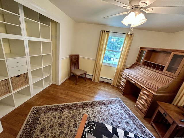 38 Tanglewood Rd, Farmington, CT 06032 - bedroom with wood finished floors, baseboard heating, and ceiling fan