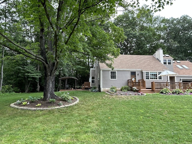 38 Tanglewood Rd, Farmington, CT 06032 - rear view of house featuring a deck, a yard, a chimney, and a shingled roof