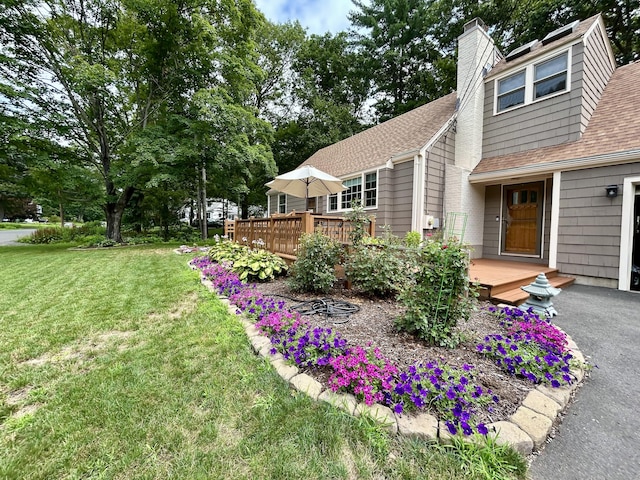 38 Tanglewood Rd, Farmington, CT 06032 - view of home's exterior featuring a shingled roof, a yard, a deck, and a chimney
