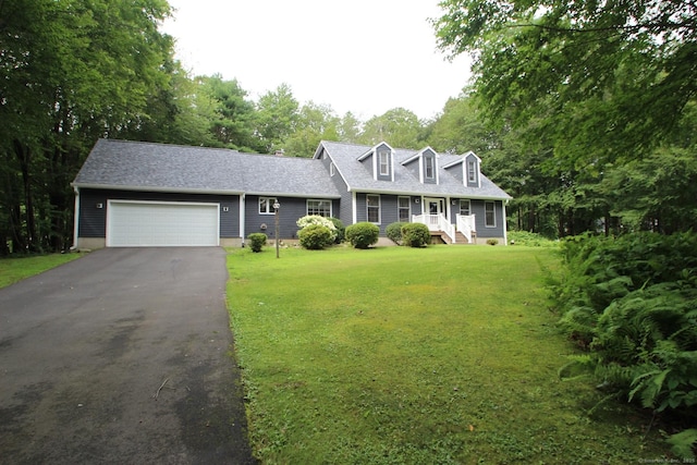 46 Ryan Rd, Tolland, CT 06084 - cape cod home featuring driveway, an attached garage, a front yard, and a shingled roof