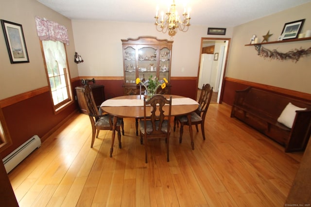 46 Ryan Rd, Tolland, CT 06084 - dining area with baseboard heating, a chandelier, and light wood-style flooring