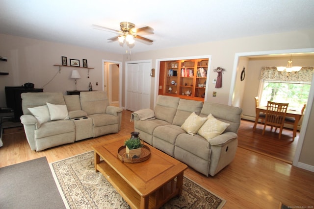 46 Ryan Rd, Tolland, CT 06084 - living area with a chandelier, light wood-type flooring, ceiling fan, and a baseboard radiator