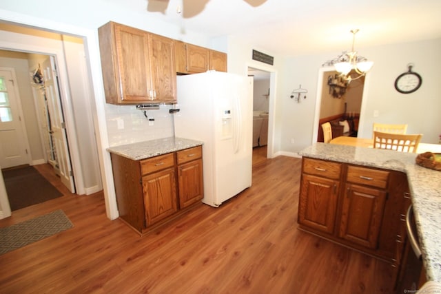 46 Ryan Rd, Tolland, CT 06084 - kitchen with white refrigerator with ice dispenser, light wood finished floors, ceiling fan, and a chandelier