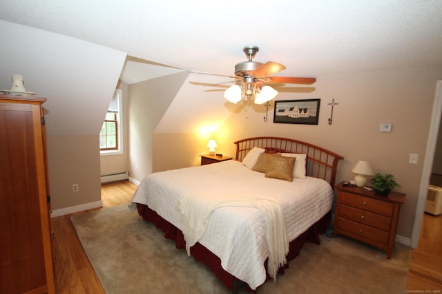 46 Ryan Rd, Tolland, CT 06084 - bedroom featuring baseboard heating, light wood-style floors, and a ceiling fan
