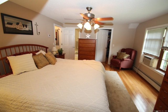 46 Ryan Rd, Tolland, CT 06084 - bedroom featuring a baseboard heating unit, light wood-style flooring, ceiling fan, a closet, and cooling unit