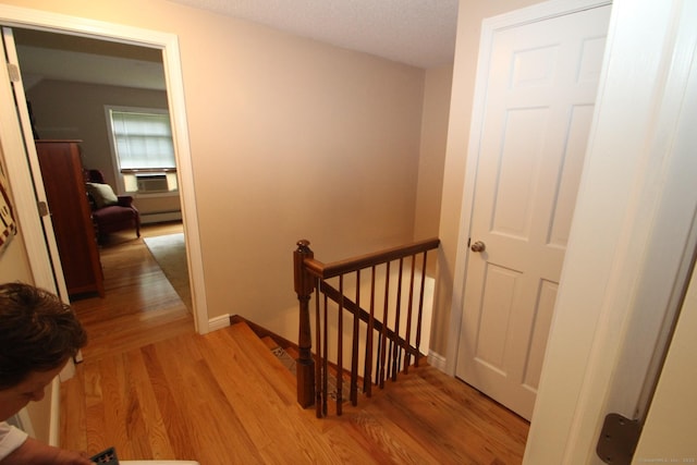 46 Ryan Rd, Tolland, CT 06084 - corridor featuring an upstairs landing, light wood-style floors, and a baseboard heating unit