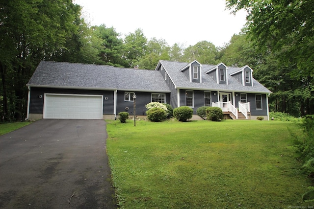 46 Ryan Rd, Tolland, CT 06084 - cape cod house featuring driveway, a front lawn, an attached garage, and a porch