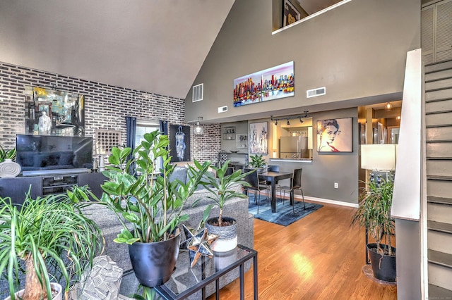 685 Quinnipiac Ave Unit 685, New Haven, CT 06513 - living area with high vaulted ceiling, brick wall, and wood finished floors