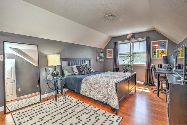 685 Quinnipiac Ave Unit 685, New Haven, CT 06513 - bedroom with wood finished floors, lofted ceiling, a textured ceiling, and an office area