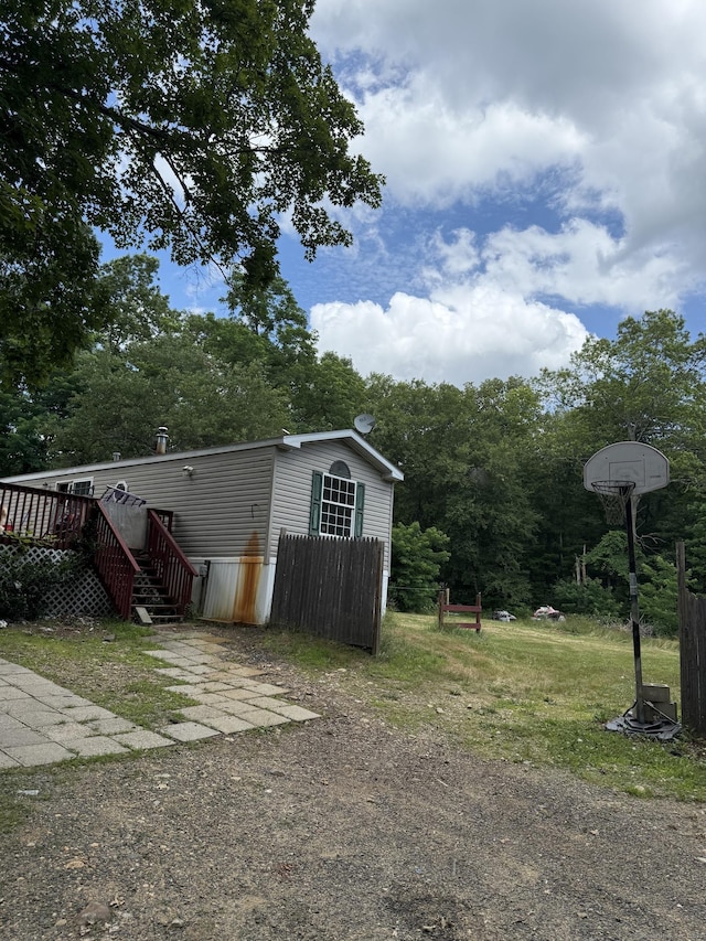 40 Ference Rd, Ashford, CT 06278 - view of yard with a deck, an outdoor structure, and view of wooded area