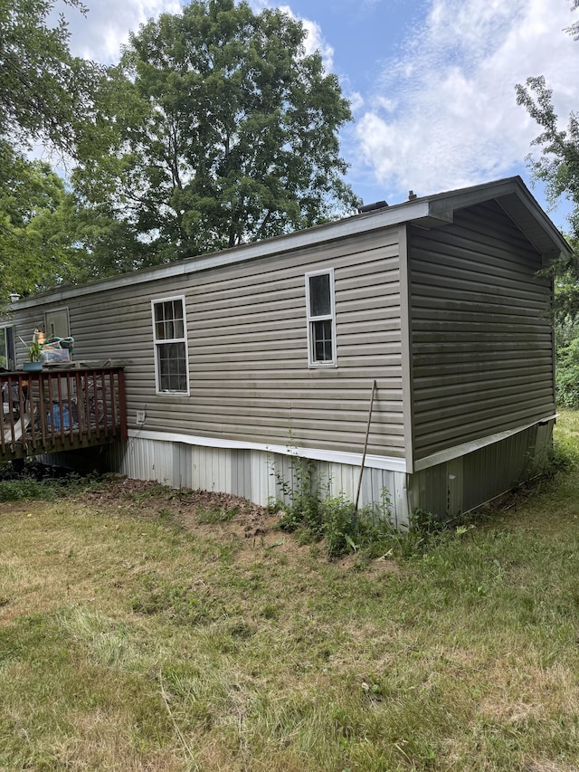 40 Ference Rd, Ashford, CT 06278 - view of side of property featuring a lawn and a wooden deck