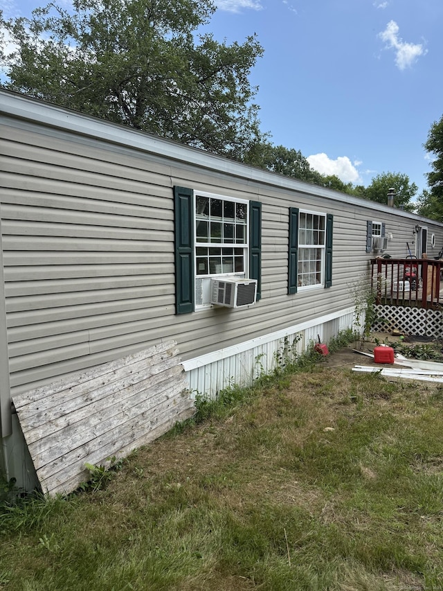 40 Ference Rd, Ashford, CT 06278 - view of property exterior with cooling unit, a deck, and a yard