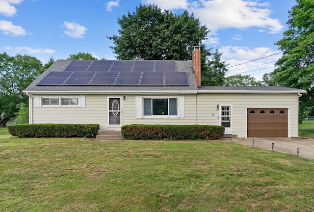 24 Claudia Ave, Brooklyn, CT 06234 - ranch-style home with an attached garage, a chimney, a front yard, and solar panels