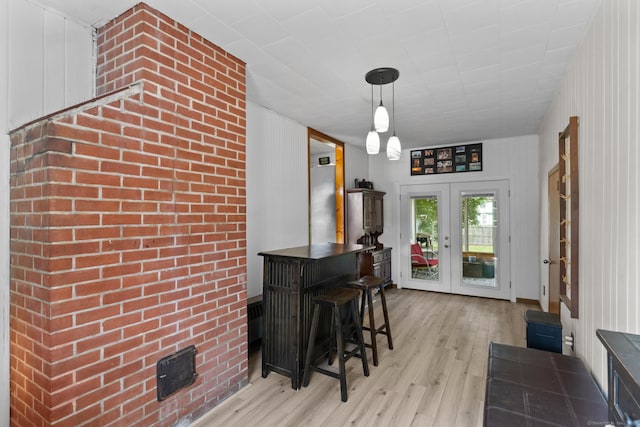 24 Claudia Ave, Brooklyn, CT 06234 - entrance foyer featuring light wood finished floors, french doors, and wood walls
