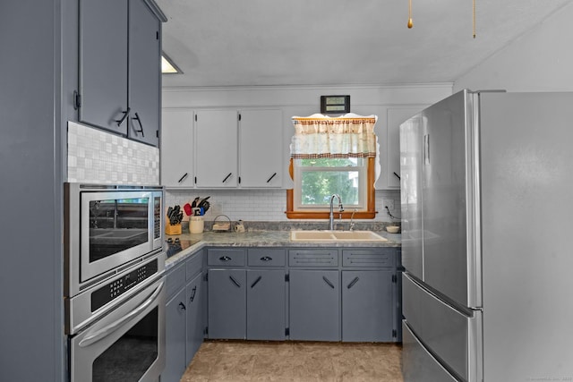 24 Claudia Ave, Brooklyn, CT 06234 - kitchen with stainless steel appliances, tasteful backsplash, and gray cabinets
