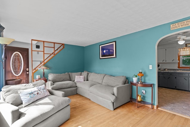 24 Claudia Ave, Brooklyn, CT 06234 - living room with light wood finished floors, arched walkways, and ceiling fan
